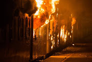 A train on Cape Town station burns on Monday evening.