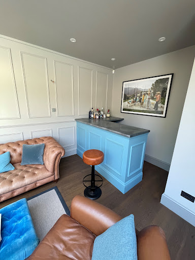 Bar area with matching panelling design 