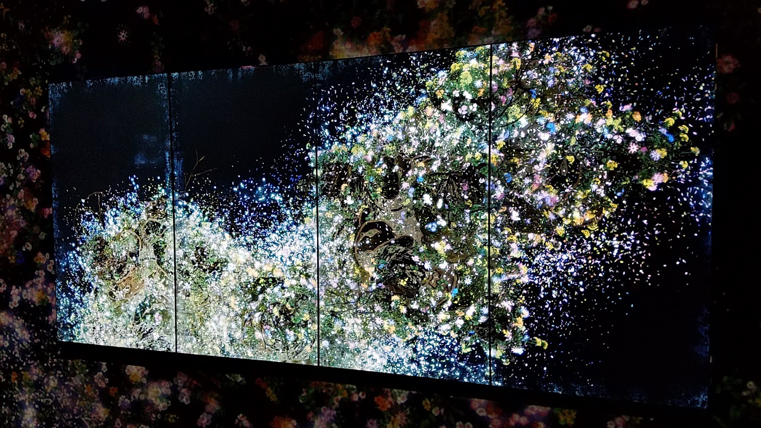 Ever Blossoming Life II - A Whole Year per Hour, Dark as part of Pace Art + Technology exhibit Living Digital Spaces and Future Parks. This is the TV screen inside the next room - it switches between Butterfly and Ever Blossoming. This artwork is in continuous change, over a period of one hour a seasonal year of flowers blossoms and scatters. Flowers are born, grow and blossom in profusion before the petals scatter, and the flowers wither and fade away. The cycle of birth and death repeats itself, continuing for eternity. The entire work changes continuously. The same state will never be repeated.