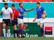 Namibia’s JC Greyling celebrates with team mate after scoring their second try during the Rugby World Cup Pool B match against Italy in Osaka.   