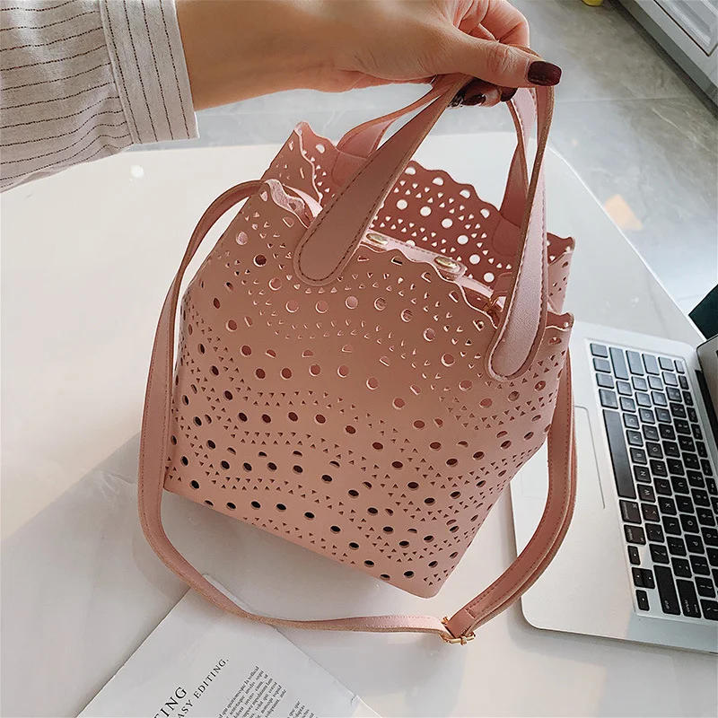Title 8, Bolsa tiracolo bucket com design versátil de um...