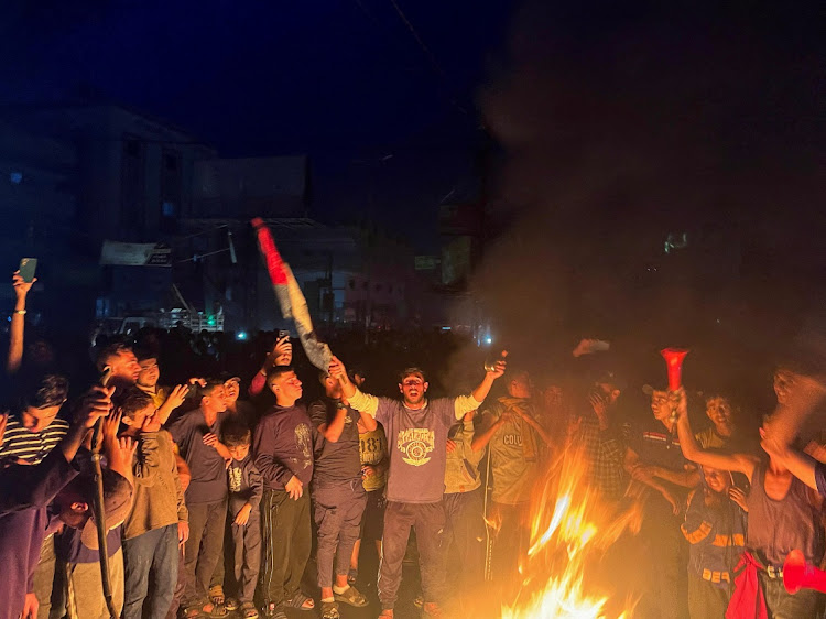 Palestinians react after Hamas accepted a ceasefire proposal from Egypt and Qatar, in Rafah,Gaza Strip, May 6 2024. Picture: REUTERS/DOAA AL BAZ