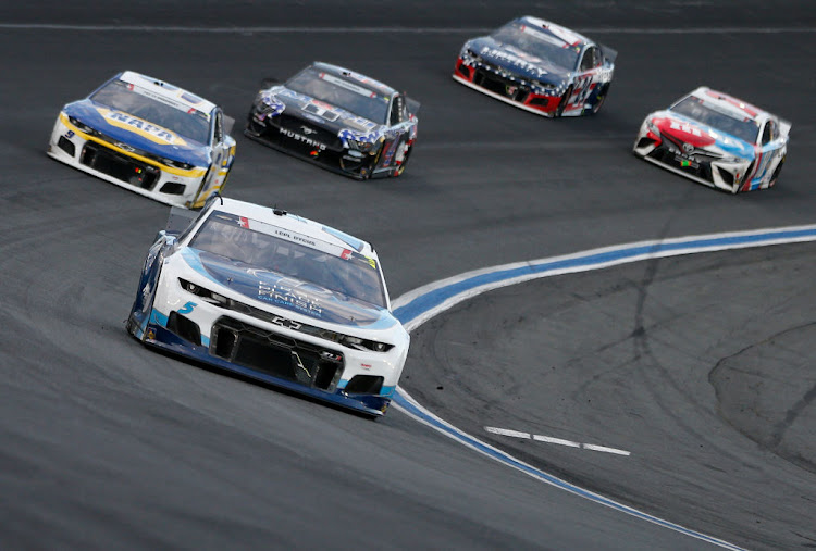 Kyle Larson, driver of the #5 Metro Tech Chevrolet, leads the field during the NASCAR Cup Series Coca-Cola 600 at Charlotte Motor Speedway on May 30 2021 in Concord, North Carolina.