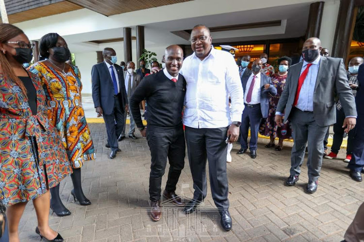 President Uhuru Kenyatta with adopted son Daniel Owira