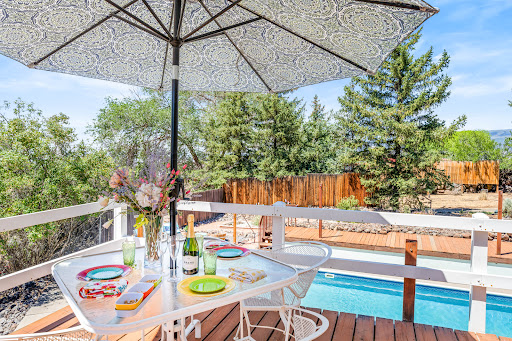 Table set on terrace with pool - Luxury house for sale in Cedaredge, 4 bedrooms