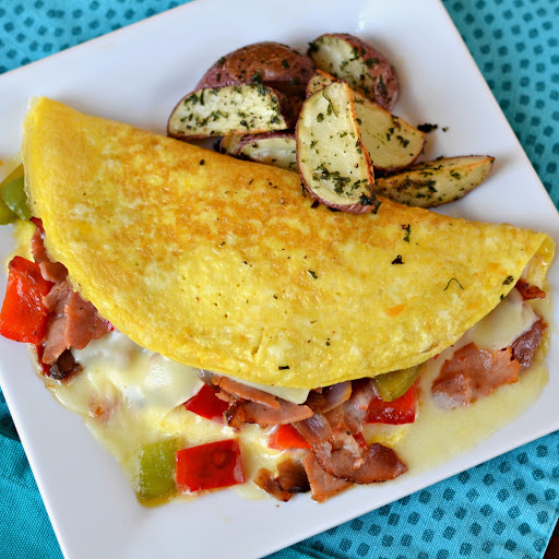 This Classic Denver Omelette brings it all together with sweet bell peppers, onions, smoked ham and gooey melted cheddar cheese.