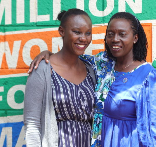 Azimio presidential running mate Martha Karua with a member of her campaign secretariat.