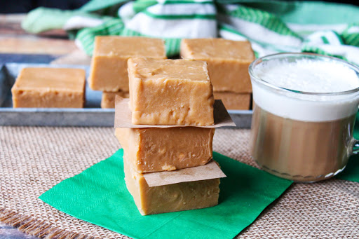 A stack of Baileys Irish Coffee Cream Fudge with coffee on the side.