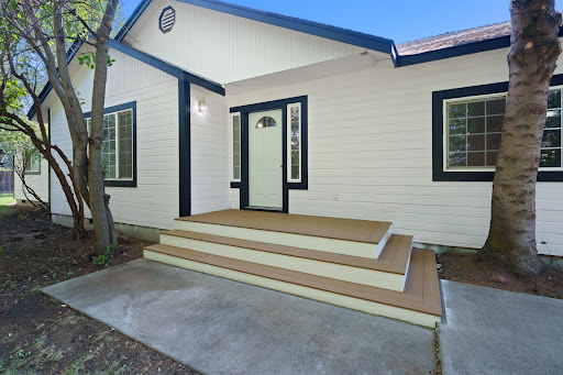 Buy this luxury property in Bend (United States) - White entrance with wooden stairs