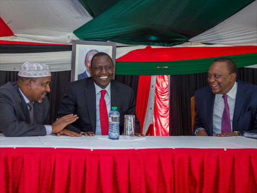 President Uhuru Kenyatta shares a light moment with Deputy President William Ruto and National Assembly Majority Leader Hon. Aden Duale when he chaired a Jubilee Parliamentary Group meeting at State House, Nairobi, which agreed to support President Uhuru Kenyatta’s proposal to reduce VAT on petroleum products to 8 per cent./COURTESY