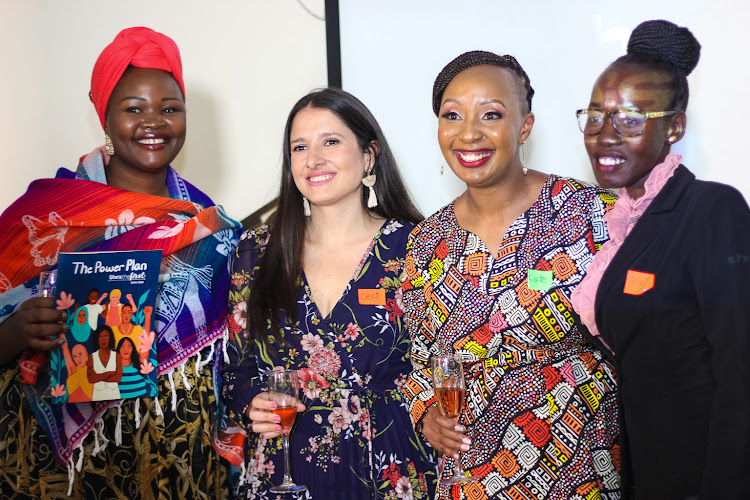 Ceci Arriaza, Senior Programs Manager (Middle left) alonside Kate Kiama, Director of Programs and Impact at She's the First (Middle right) with attendees at the launch of She's the First's Strategic Launch.