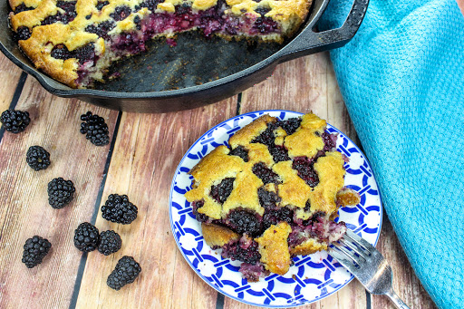 A slice of Blackberry Cobbler on a plate.