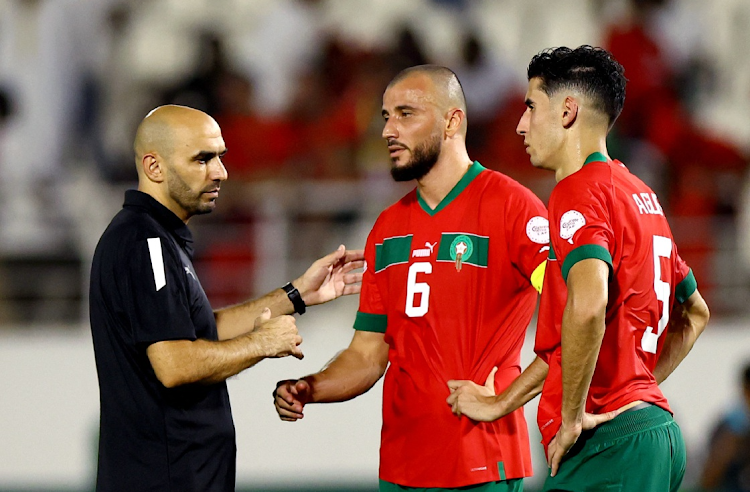 Morocco coach Walid Regragui and players Romain Saiss and Nayef Aguerd look dejected after their Africa Cup of Nations last 16 defeat against Bafana Bafana at Stade Laurent Pokou in San Pedro, Ivory Coast on Tuesday night.