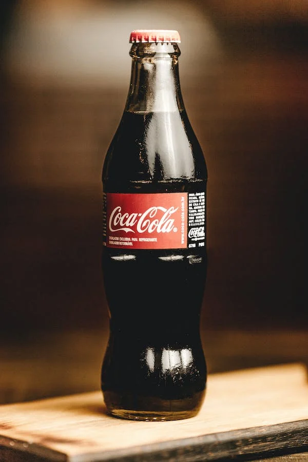 How to clean your wedding ring at home; a bottle of coca cola 