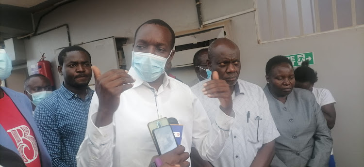 Kisii County Governor Simba Arati visiting baby Junior Sagini in hospital a fortnight ago. Doctors have advised him to pay them on time to avert strikes.