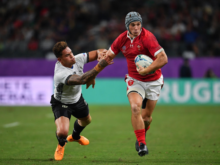 Wales' Jonathan Davies hands off Fiji's Jale Vatubua to set up Josh Adams' third try during the Rugby World Cup 2019 Group D game between Wales and Fiji at Oita Stadium on October 9, 2019 in Oita, Japan. Picture: ASHLEY WESTERN / MB MEDIA / GETTY IMAGES