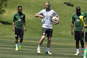 South African national mens soccer team coach Stuart Baxter with Thulani Seraro and Hlompho Kekana during the South African national mens soccer team training session at Steyn City School on November 13, 2018 in Johannesburg, South Africa. 