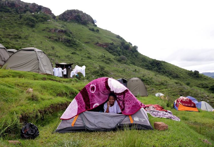 A maiden in a tent erected on Mount Nhlangakazi as Ekuphakameni Nazareth Baptist Church observe their holy pilgrimage.