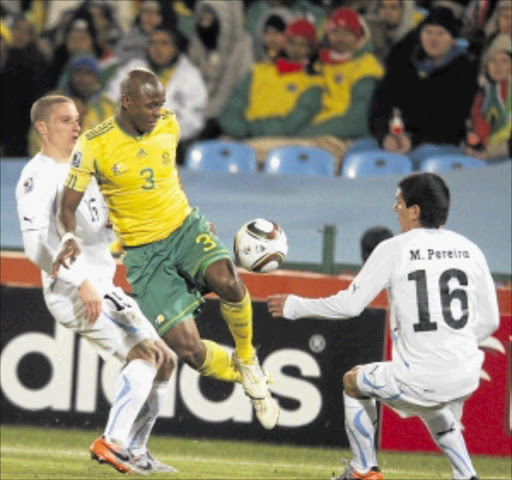 NEEDING SURGERY: Bafana Bafana and Maccabi Haifa left-back Tsepo Masilela, centre, will not rejoin Haifa next season. Photo: Antonio Muchave