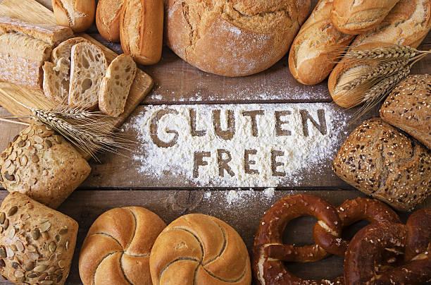 gluten free breads on wood background a gluten free breads on wood background celiac stock pictures, royalty-free photos & images