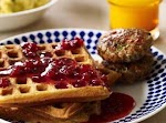 Savory Sour Cream and Chive Waffles with Sausage and Lingonberry Syrup was pinched from <a href="http://www.rachaelray.com/recipe.php?recipe_id=2027" target="_blank">www.rachaelray.com.</a>