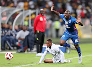 Graig Martin of Cape Town City is fouled by Aubrey Modiba of SuperSport United during the MTN8 final match at the Moses Mabhida Stadium, Durban on September 29, 2018.