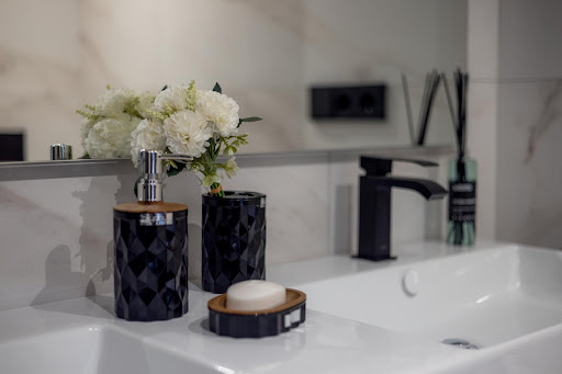 Black bathroom accessories and flowers in this luxury apartment / penthouse for sale in Marbella ($1,674,927 - 138 m²)