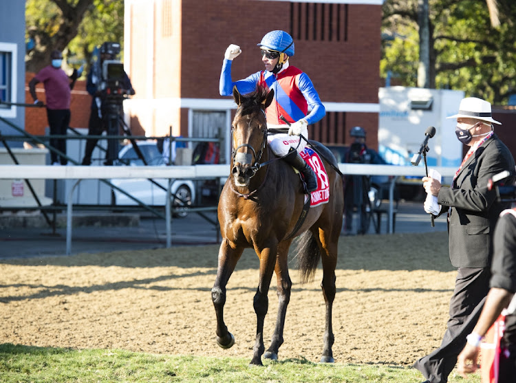 With the Vodacom Durban July winners sash around his neck Kommetdieding with jockey Gavin Lerena enjoys the victors canter at Hollywoodbets Greyville Racecourse on July 4 2021. Picture: ANTHONY GROTE/GAMEPLAN MEDIA