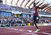 Kenya's Emmanuel Kipkurui Korir celebrates as he crosses the line to win the men's 800m final. 