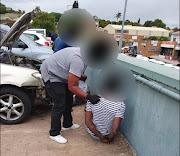 Members of police arresting two men believed to be involved in a truck theft syndicate operating in  KwaZulu-Natal.