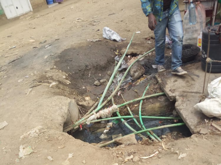 Water pipes passing through an open sewage.