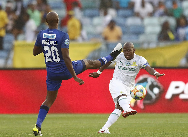 Mamelodi Sundowns captain Hlompho Kekana attempts a shot while Judas Moseamedi of Maritzburg United tries to block in the 2019 Telkom Knockout final at Moses Mabhida Stadium in Durban on Saturday.