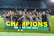 Orlando Pirates coach Jose Riveiro celebrates with his technical teams after the Nedbank Cup final against Sekhukhune United at Loftus Versfeld Stadium on March 27, 2023.