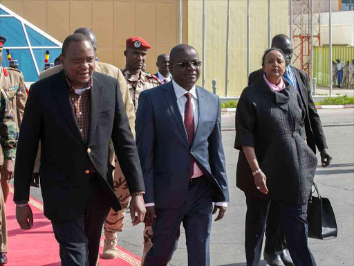 President Uhuru Kenyatta with the Prime Minister of Chad Albert Pahimi Padacké when he made a stopover at Hassan DjamousInternational Airport in Nd'jamena, Chad while on his way to Kenya from Morocco.Also present is Foreign Affairs Cabinet Secretary, Amina Mohamed on November 18,2016.Photo PSCU