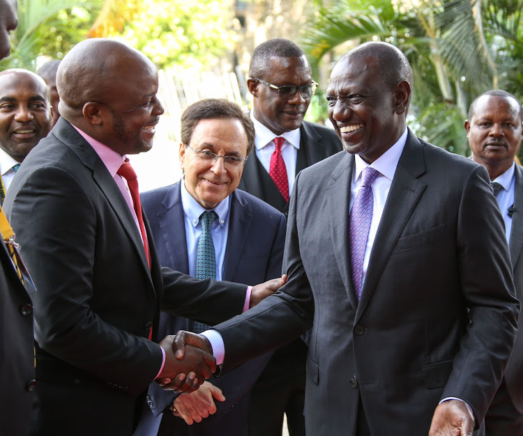 Langata MP Phelix Odiwour alias Jalang'o greeting President William Ruto during the ID for Africa Conference in Nairobi on May 24, 2023.