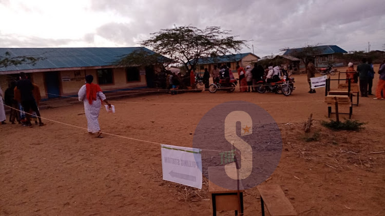 Kenyans queue at Handampia primary school in Galole constituency Tanariver County to cast vote on Tuesday, August 9,2022.