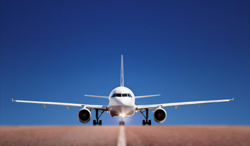 An airplane lands on the runway.