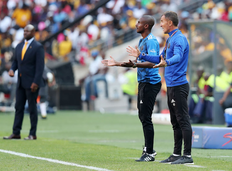 Orlando Pirates' head coach Milutin Sredojevic (R) and his assistant Rhulani Mokoena reacts to the referee during the Absa Premiership 2017/18 match against Kaizer Chiefs at FNB Stadium in Johannesburg, South Africa on 21 October 2017.