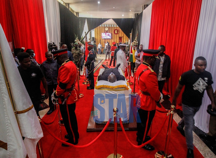 Members of the Public viewing the body of Kenya's 3rd president Mwai Kibaki lying in state at the Parliament building on April 25,2022