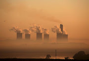 Steam rises at sunrise from the  Lethabo Power Station near Sasolburg, South Africa, March 2, 2016.