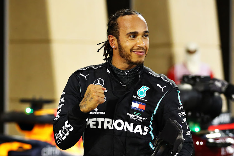 Race winner Lewis Hamilton of Great Britain and Mercedes GP celebrates in parc ferme during the F1 Grand Prix of Bahrain at Bahrain International Circuit on November 29, 2020 in Bahrain, Bahrain.