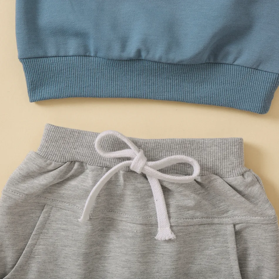 Ensemble de vêtements pour enfants, haut à col rond avec imprimé lettres, pantalon uni, confort et style pour les journées actives.