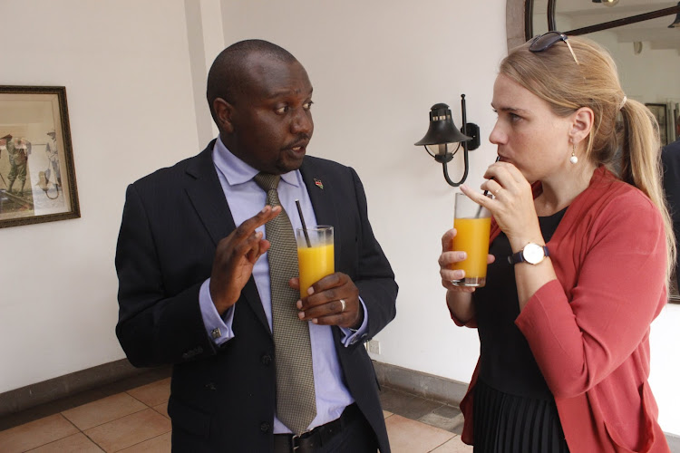 MCK chief executive David Omwayo and British High Commission's Alice Simpson