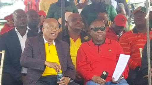 President Jacob Zuma and SACP general secretary Blade Nzimande sit together as rally-goers in Bloemfontein disrupt Cosatu’s May Day proceedings on Monday. File photo