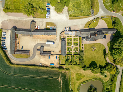 Farm buildings, paved courtyard and garden in this luxury property for sale in Derby ($3,983,508)
