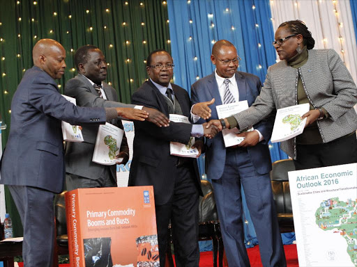 Principal Secretary of Planning Saitoti Torome and other stakeholders during the launch of the African Economic Outlook(AEO) 2016 report and the primary commodity booms and dusts at the UON./FILE