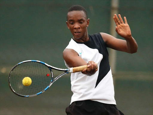 Olivier Kigotho returns to Ananda Petty during the All Africa Games preliminary trials at Nairobi Club on June 6, 2015. Photo/Mohammed Amin/www.pic-centre.com (KENYA)