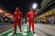 Charles Leclerc of Monaco and Ferrari walks to the grid before the F1 Grand Prix of Sakhir at Bahrain International Circuit on December 6 2020. 