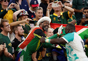 South African Trevor Nyakane celebrates with fans after the match between the Springboks and Scotland.