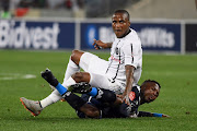 Thembinkosi Lorch of Orlando Pirates lands on Thabang Monare of Bidvest Wits during the Absa Premiership match between Bidvest Wits and Orlando Pirates at Moses Mabhida Stadium on September 21, 2019 in Durban, South Africa. 